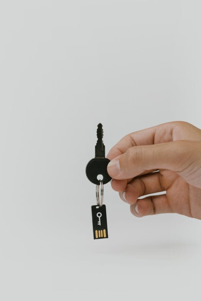 Digital memory card attached to a key to indicate digital permissions