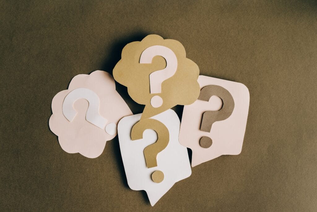 Questions depicted as question marks in construction paper cut-outs
